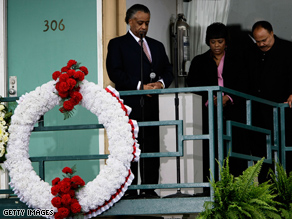 Martin Luther King III and his sister Bernice observe a moment of silence with the Rev. Al Sharpton at 6:01pm, the moment when Martin Luther King Jr. was shot on the balcony of the Lorraine Hotel, on the 40th anniversary of his assassination.