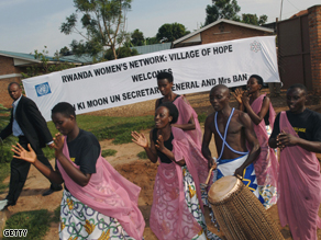 People sing and dance outside the Rwanda Women's Network Centre in Kigali in January 2007.