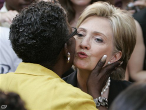 Sen. Hillary Clinton gets a kiss from Rep. Stephanie Tubbs Jones during a rally in Washington on June 7, where she suspended her campaign for president.