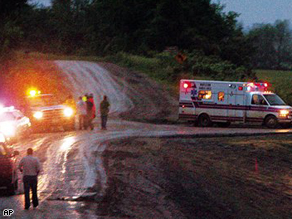 An ambulance transports people injured by a tornado that touched down a Boy Scout camp near Little Sioux, Iowa, Wednesday evening.