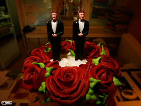 Same-sex wedding cake topper figurines are seen at Cake and Art in West Hollywood, California