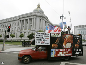 A protest truck against same sex marriages circles around City Hall in San Francisco, Monday.