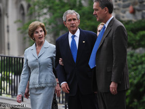 President and Laura Bush speak with Vance Wilson, the Headmaster of St. Albans School in Washington where Russert's wake is being held Tuesday.