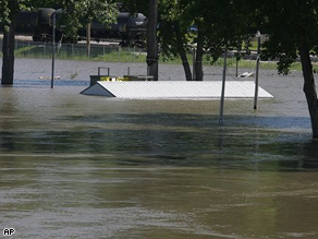 A picnic shelter at the Quincy River Front park shows the water level rising from the Mississippi River near Quincy, Ill.