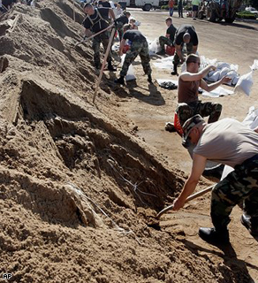 Air National Guard members help fill sandbags along the Mississippi River in Quincy, Ill. today.