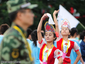 Students dance during the Olympic torch relay Tuesday in Urumqi, China's Xinjiang Uighur Autonomous Region.