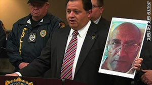 Morris County Prosecutor Robert Bianchi holds up a photo of Jose Feliciano.