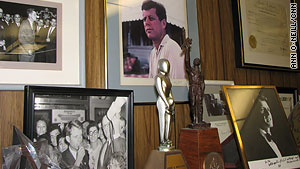 Photos of his years with the Kennedys are displayed in Morgenthau's office.