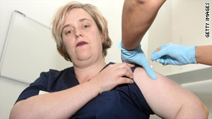 A British nurse receives the swine flu vaccine at the University College London Hospital in London.
