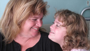 Hayli Murphy, with mom Julie, tested negative for the H1N1 virus twice despite being infected.