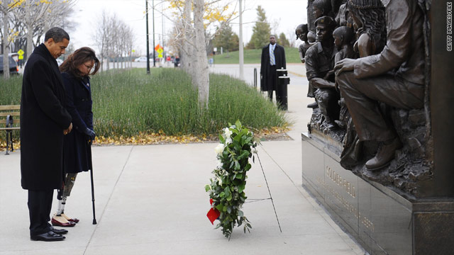 L. Tammy Duckworth and Barack Obama place a wreath at a soldiers memorial in Chicago, Illinois, on Veterans Day 2008.