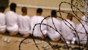 Detainees at the Guantanamo Bay detention center kneel during a prayer on October 28.