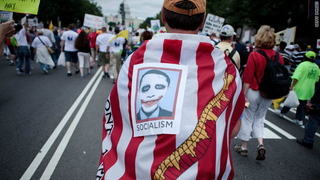 Protesters march through Washington at a Tea Party Express rally on September 12.