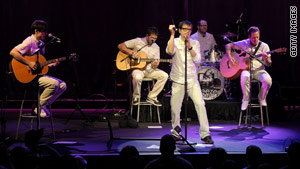 Weezer lead singer Rivers Cuomo, 40, front, was transported to a New York hospital Sunday.