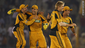 Australian players celebrate a Shane Watson wicket in their 24-run victory.