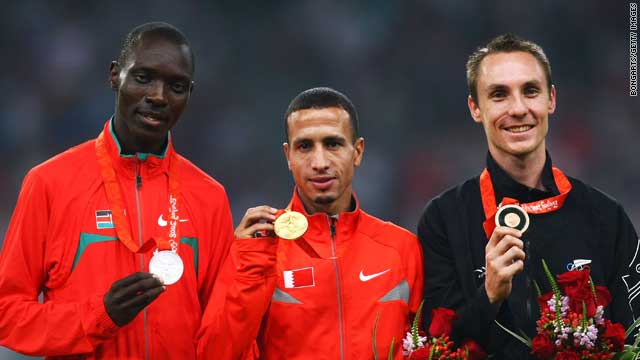 Ramzi (C) holds his Olympic gold medal in Beijing, alongside Asbel Kipruto Kiprop (L) and Nicolas Willis (R)