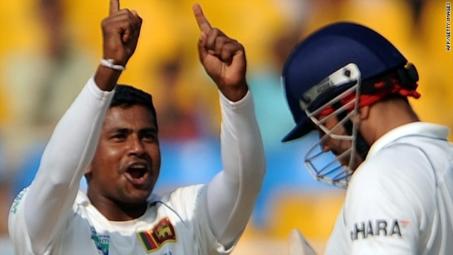 Sri Lanka spinner Rangana Herath celebrates after dismissing India opener Virender Sehwag.