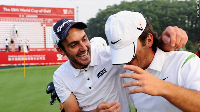 Edoardo (left) and Francesco celebrate on the final green after holing the winning putt.