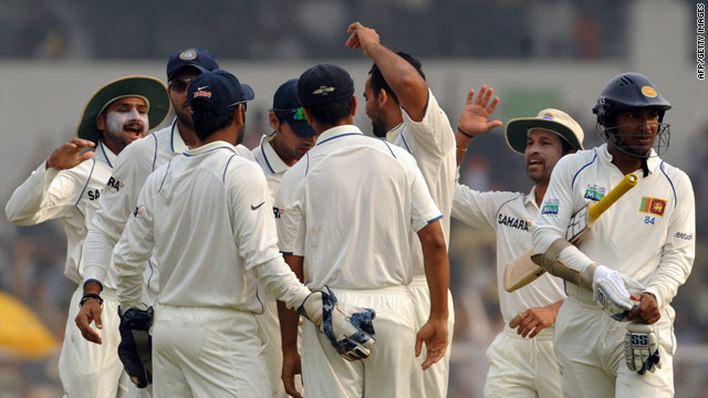 India players celebrate taking the wicket of  Kumara Sangakkara on their way to a series victory.