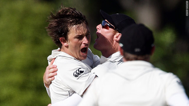 Bond (left) is congratulated by teammates after taking a wicket in his final Test.