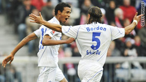 Matip wheels away after scoring Schalke's equalizer at the Allianz Arena.