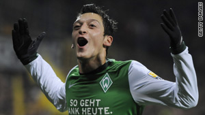 Werder Bremen midfielder Mezut Oezil celebrates after putting his team ahead against Dortmund.