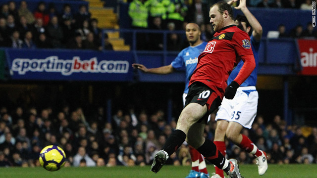 Manchester United striker Wayne Rooney scores his second goal in the 4-1 win at Portsmouth.