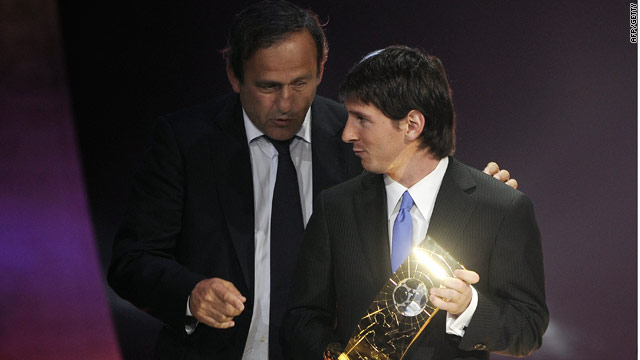 Messi exchanges a moment with Michel Platini after getting his award.