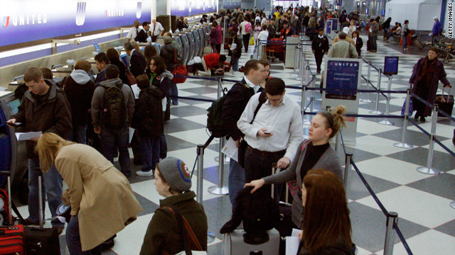 Passengers wait to check in Wednesday at the United Airlines terminal at O'Hare International Airport in Chicago, Illinois.