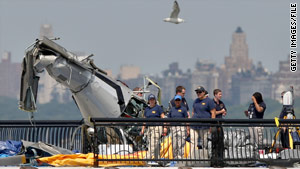 The FBI investigates the remains of the helicopter involved in the August collision that triggered the new rules.