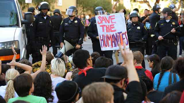 Students block a vehicle with college staff members during a protest Thursday at the University of California, Los Angeles.