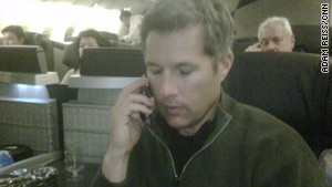 David Goldman appears aboard a jetliner flying to Brazil.