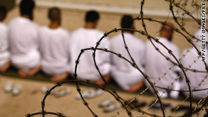 A group of detainees pray at Guantanamo Bay, Cuba, detention center, earlier this year.