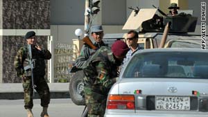 Afghan soldiers and police man a checkpoint in central Kabul on October 22, 2009.