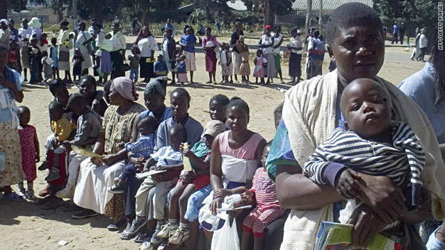 Women queue in June 2006 to have their children immunized against measles in Harare's poor suburb of Mabvuku.