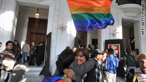 Demonstrators celebrate the vote Monday in Mexico City.