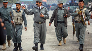 Afghan police rush to the site of a Taliban attack on a hotel  in Kabul on Wednesday.