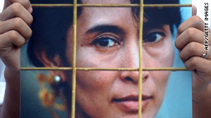 A Myanmar activist holds a portrait of Aung San Suu Kyi during a protest in Bangkok on August 16, 2009.