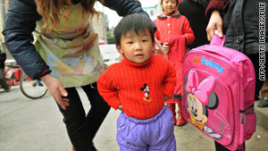 A young Chinese girl displays Disney products in Shanghai's town of Chuansha on March 7, 2008.