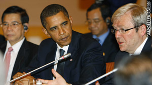 U.S. President Barack Obama, center, listens to Australian Prime Minister Kevin Rudd in Singapore.