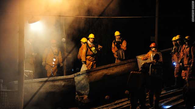 Rescue workers enter a mine shaft on Sunday to save workers still trapped deep underground in China's Heilongjiang province.