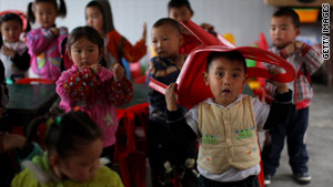 Children play in a temporary classroom in Sichuan Province, one year after the devastating earthquake.