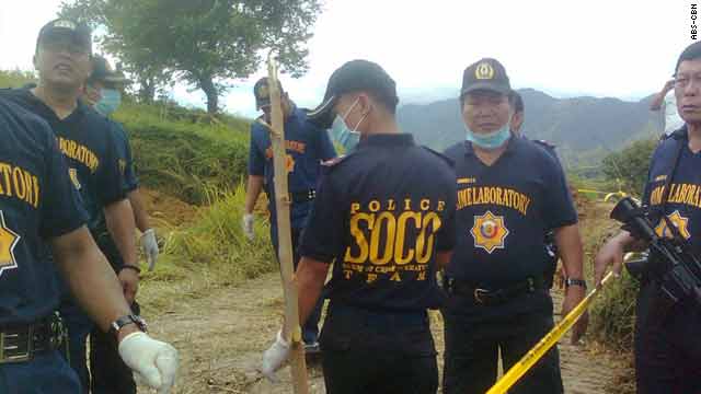 Police investigate where the bodies were found in Maguindanao, Philippines.