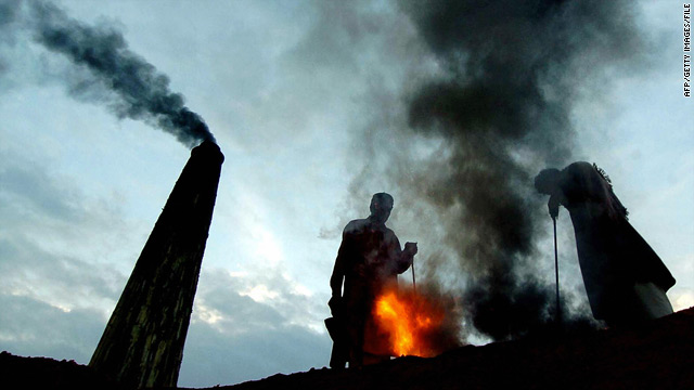 Laborers work at a brick kiln near Lahore, Pakistan.