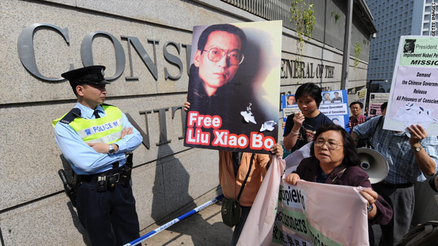 Protesters holding a picture of Liu Xiaobo march to the U.S. consulate in Hong Kong on November 13, 2009 to ask for his release.