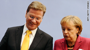 German Chancellor Angela Merkel and Guido Westerwelle, Germany's new foreign minister, present their coalition government programme in Berlin
