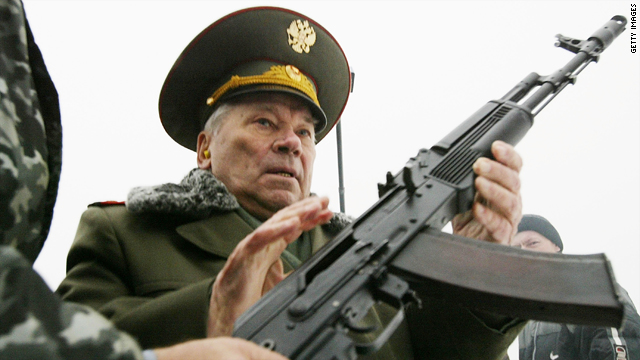 Mikhail Kalashnikov is handed an AK-47 on November 23, 2002, in Izhevsk, Russia.