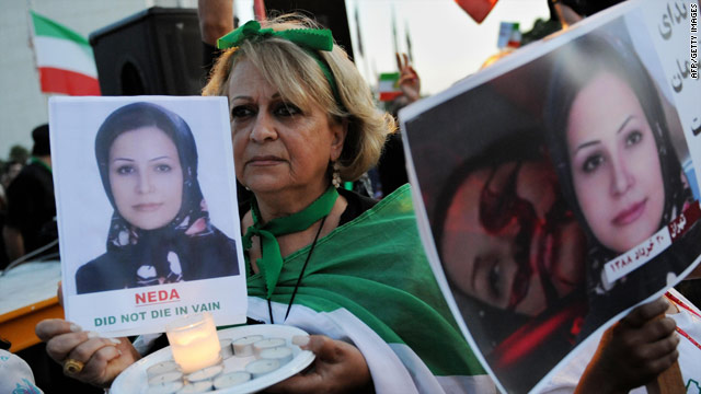 Iranian demonstrators hold photographs of Neda Agha-Soltan at an event in Los Angeles.