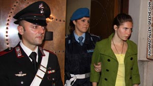 Amanda Knox is led into the court in Perugia Friday, on what is expected to be the last day of her trial.