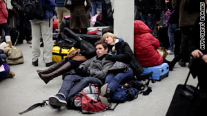 Stranded passengers wait at a London terminal Saturday after a series of train breakdowns inside the Channel Tunnel.